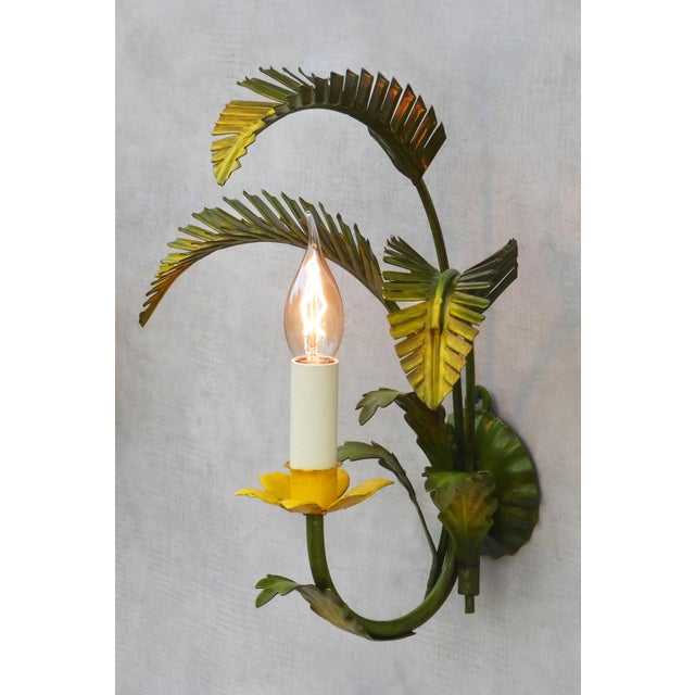 Gorgeous Italian hand-painted toleware botanical-themed wall light sconces. Glossy palm leaf foliage surrounding a...