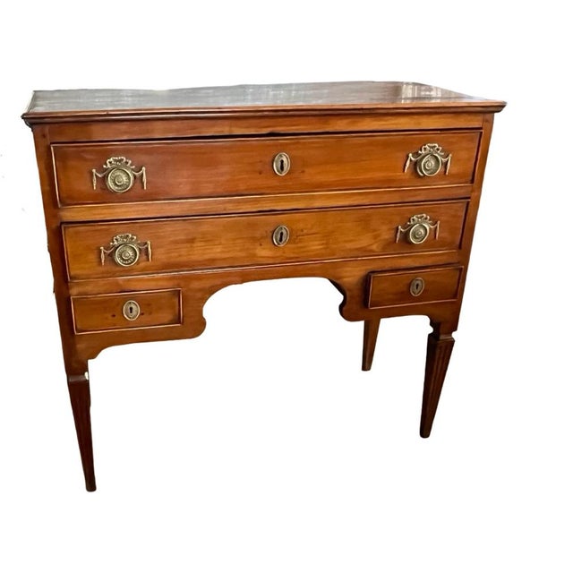 Neoclassical Louis XVI commode hand-made in Italy in the late 1700s using cherry. The commode has very straight and...