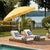 Transform your outdoor space with the panza 9 ft crank umbrella in a vibrant yellow and white pole design. Crafted from...