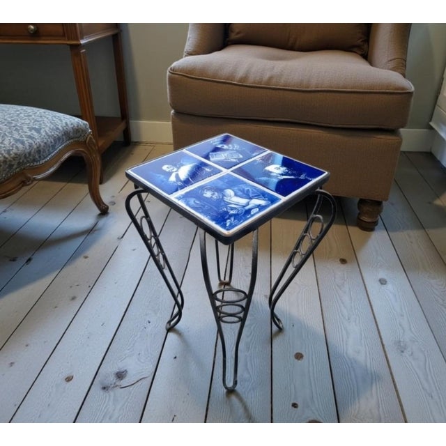 Charming vintage Delft Blue tile side table / plant stand, featuring four classic Dutch blue-and-white ceramic tiles set...