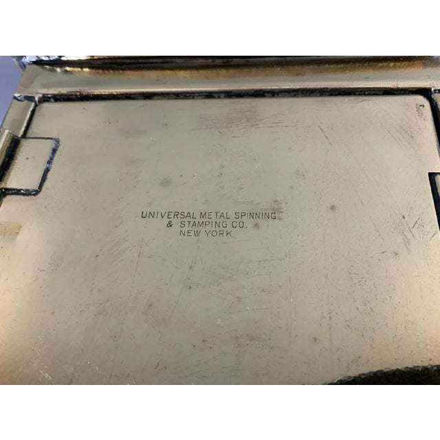 Solid brass bow light, early twentieth century. Door on rear is embossed Universal Metal Spinning and Stamping Company of...