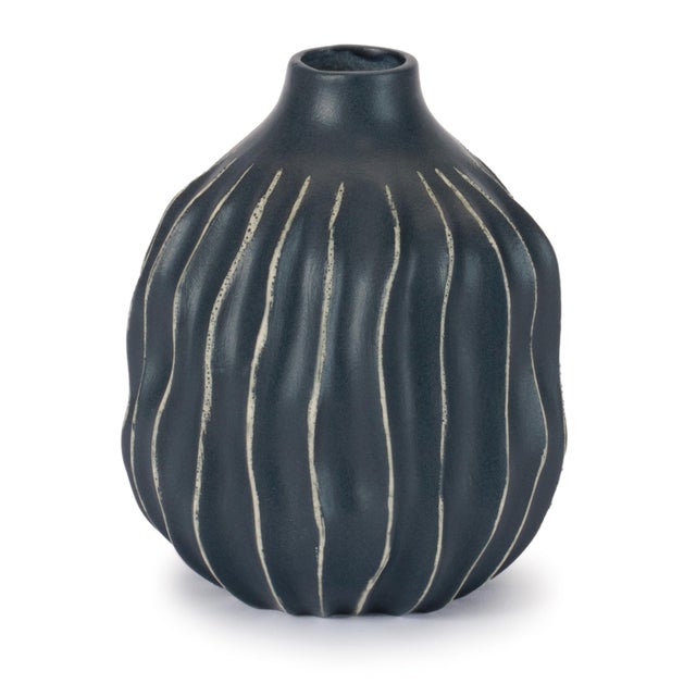 Elevate your décor with the bold, modern style of this set of Wavy Ribbed Stoneware Vases. Featuring a sculptural...
