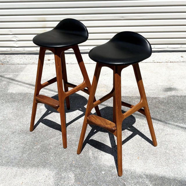 Pair of iconic Erik Buch for Oddense Maskinsnedkeri Danish teak barstools. Collector’s may recognize these barstools as...