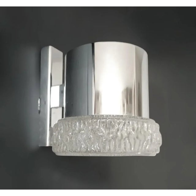 Italian wall lights with clear bollicine Murano glass shades mounted on chrome structures, designed by Gino Sarfatti for...