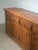 Beautiful vintage wooden sideboard originating from India, featuring a warm tone and timeless craftsmanship. This piece...