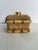 A single rectangular shaped lidded ceramic box featuring faux bamboo trim and handle with woven patterned sides. Interior...
