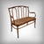 This bentwood bench, stamped J&J Kohn, is distinguished by the natural elegance of its lines and the exceptional mastery...
