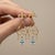 Metal Fleur De Lis Chandelier Earrings Studs With Topaz in Silver, Gold, A Pair For Sale - Image 7 of 10