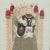 A Chinese framed print offers mixed media depiction of ceremonial deity mask, 20th century. Measures - 18" H x 14.25" W x...