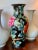 Chinese hand painted porcelain vase featuring colorful peonies in pink, rust orange, yellow, and light green against a...