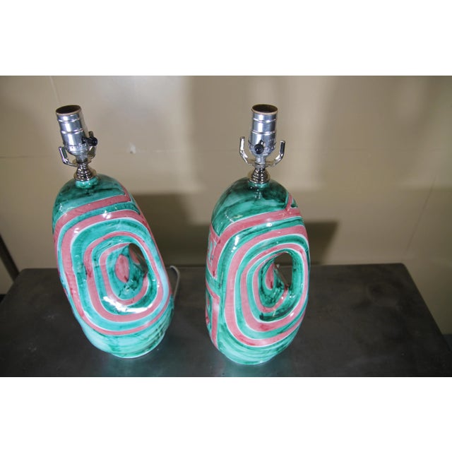 Wonderful old new stock hand painted Italian table lamps. New wiring and socket. Signed and numbered on the Bottom. These...