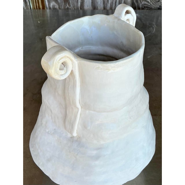 Add sculptural charm to your space with this one-of-a-kind vintage studio pottery scroll vase. Expertly hand-formed with...