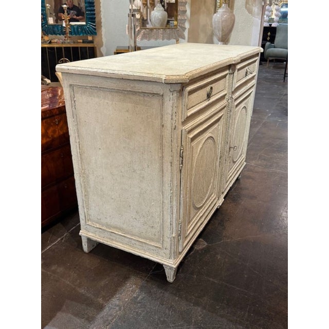 19th century French carved and painted oak buffet. French painted oak buffets are beloved for their provincial charm,...
