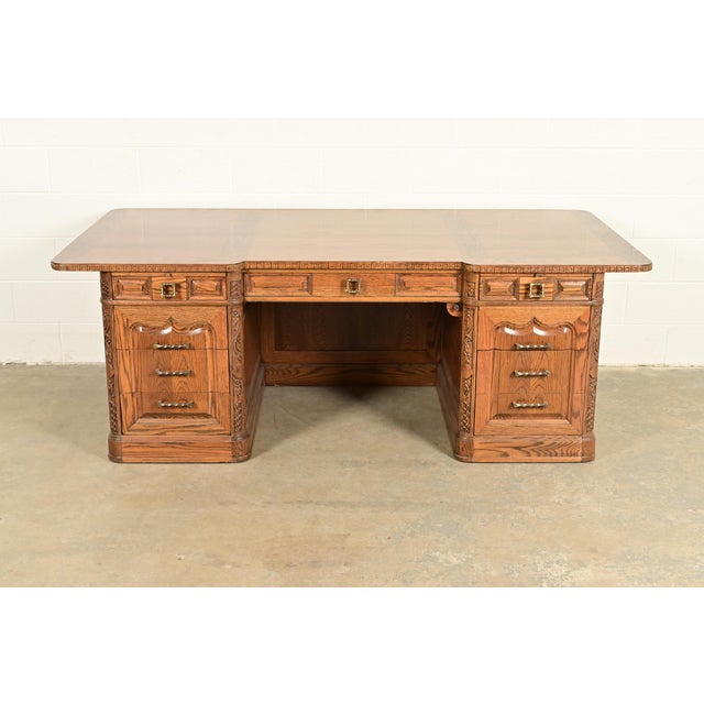 A gorgeous Scandinavian or Nordic "Viking Oak" executive desk By Romweber USA, Circa 1960s Carved oak, featuring Nordic...
