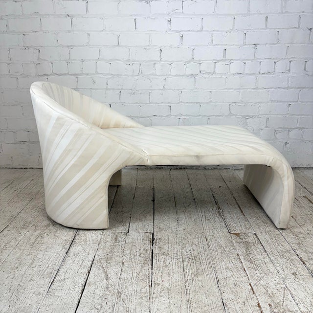 Chaise lounge that is currently covered in a white striped fabric. This is an unknown maker as there are no makers marks.