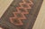 A tribal Bokhara Jaldar rug hand-knotted with fine wool on a cotton foundation. This rug features geometric medallions set...