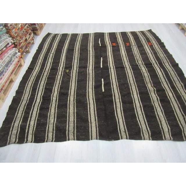 Handwoven vintage striped kilim rug from Afyon region of Turkey. In very good condition. Approximately 45-55 years old