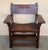 19th century walnut Spanish colonial altar armchairs with leather back and seat The unusual size of the arms complete this...