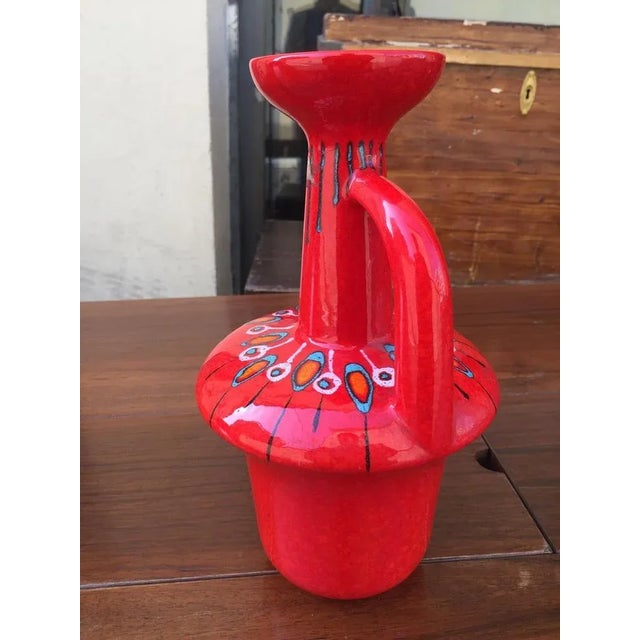 Elegant Italian ceramic jug produced by Bertoncello, in perfect condition and with a very particular shape, decorated with...