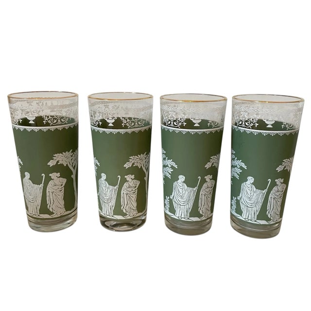 This is a set of eight Wedgewood Jasper juice glasses in the Jeanette pattern. The glasses feature Greek figures and are a...