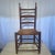 Beautiful antique ladder back chair with wooden seat.