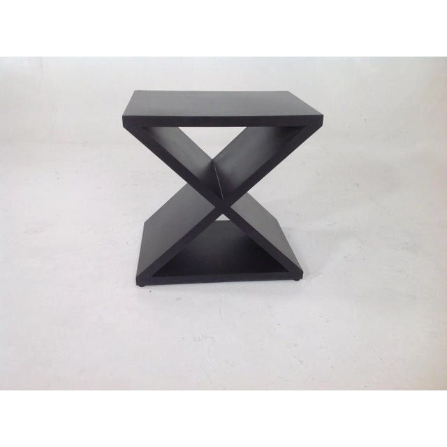 Modern mid century style wood end table with a ebony finish. Table is made of alder. Satin finish. Unique style for a...
