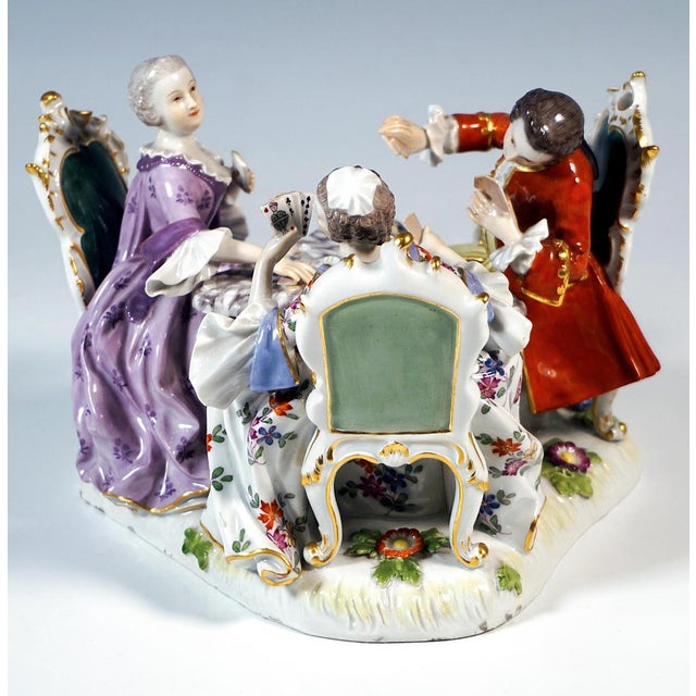 Exquisite rare genre group from the 19th century: two ladies and a gentleman in elaborate, elegant rococo clothing sitting...