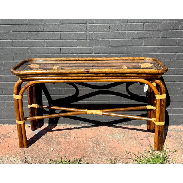 High-quality vintage rattan bamboo glass top table set. Console table dimensions: 46”L X 18”D X 29”T Side table...