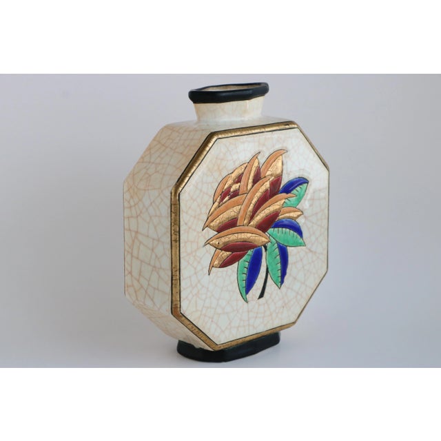 Circa 1930's vase from Emaux de Longwy, France. This octagon-shaped vessel features a polychrome floral motif on both...