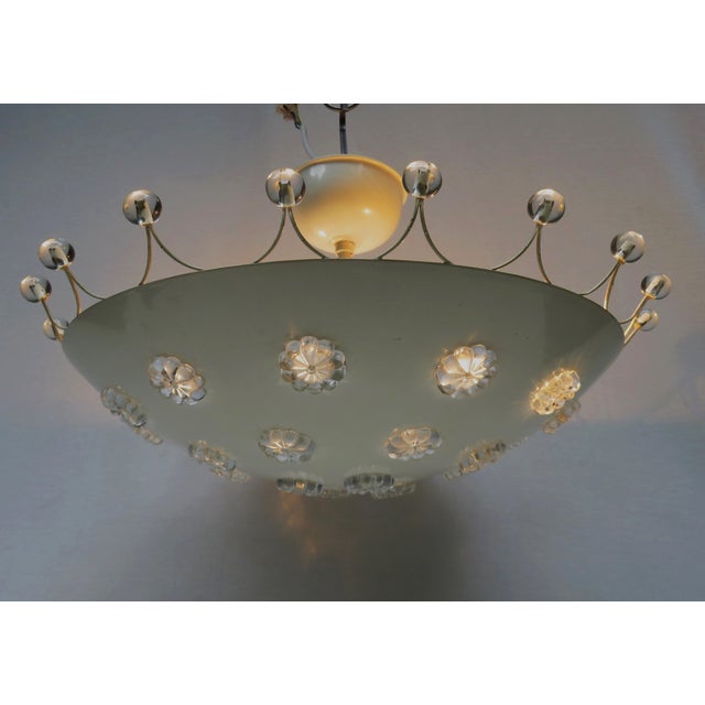An exceptional set consisting of a ceiling light and a pair of wall lights, manufactured in the 1950s by l.a. Riedinger...