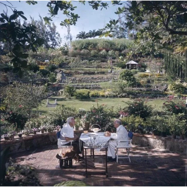 Dining Al Fresco 1976 by Slim Aarons Slim Aarons Limited Estate Edition Victor Marson (left) and George Amos dine in the...