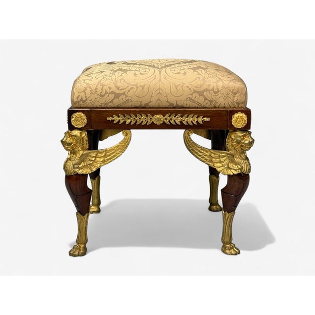 French Empire Revival, Bronze, Mahogany, Fabric, Footstool or Ottoman, France, 19th c. A striking antique stool featuring...