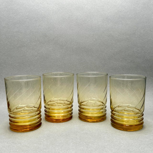 Vintage set of 4 MCM Libbey “Malibu Gold” juice glasses. They are a honey gold color with a ribbed lower body and swirl...