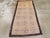A vintage Turkish Konya rug. An abrashed old ivory ground displays three columns of seven blue openwork palmettes and thin...