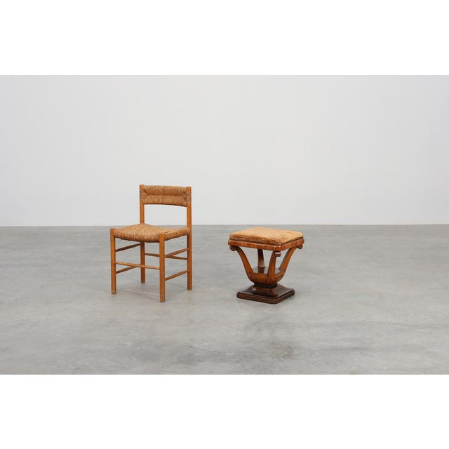 A refined and sculptural Italian Art Deco stool from the early 1920s, crafted in richly toned walnut and showcasing the...