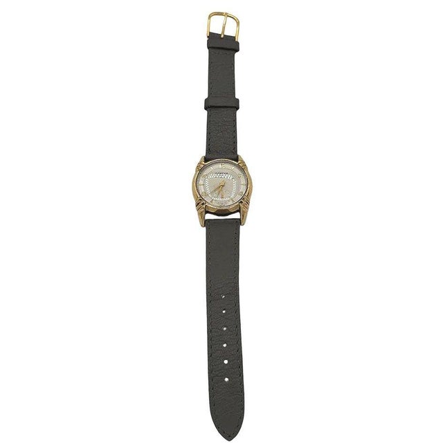 This Swiss Made Geneva men's watch from circa 1970 is a timeless piece that exudes understated sophistication. The large...