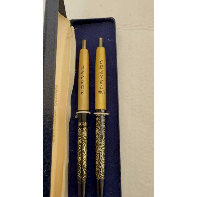 An exceptionally rare and elegant mid-century vanity collectible, this vintage writing set includes two perfumed ballpoint...