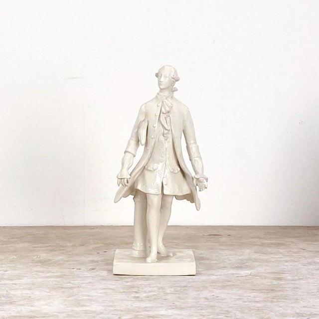 A pair of late 19th Century French white porcelain figures of a man and a woman in 18th Century customs, circa 1880.