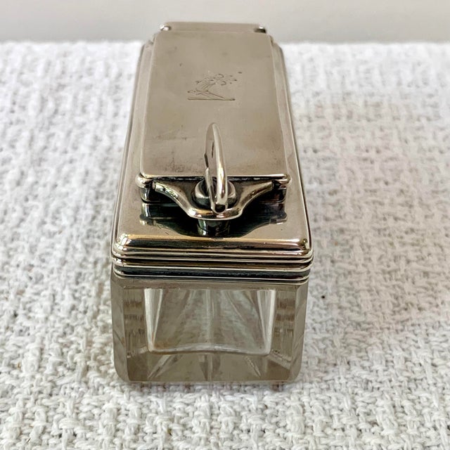 Sterling Silver and Cut Crystal Traveling Inkwell. It has a hinged silver top with reeded edges and a secure lockdown.....