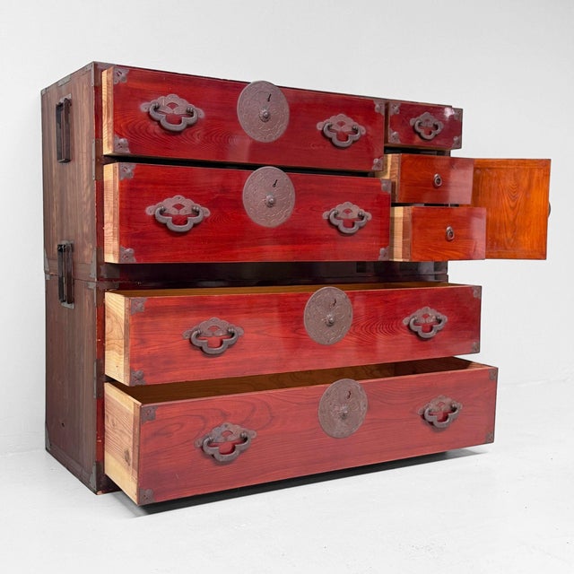 Characterful Japanese kimono tansu (isho-dansu) from the late Meiji period, constructed in two sections that are firmly...