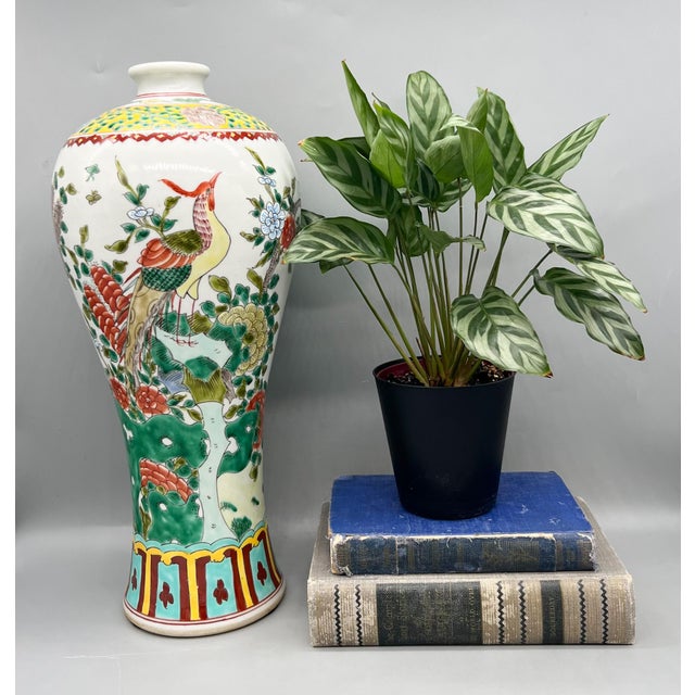 Stunning, mid to late 20th century Chinese hand-painted porcelain vase decorated in the classic famille verte palette. A...