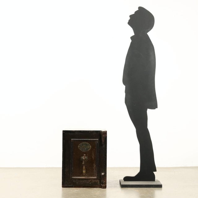 Small reinforced metal safe, late 1900s England, bronze label on the door with indication of the manufacturing company and...