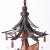 Whimsical vintage chandelier with asian motifs crafted in wood paint decorated in a polychrome style featuring a pagoda...