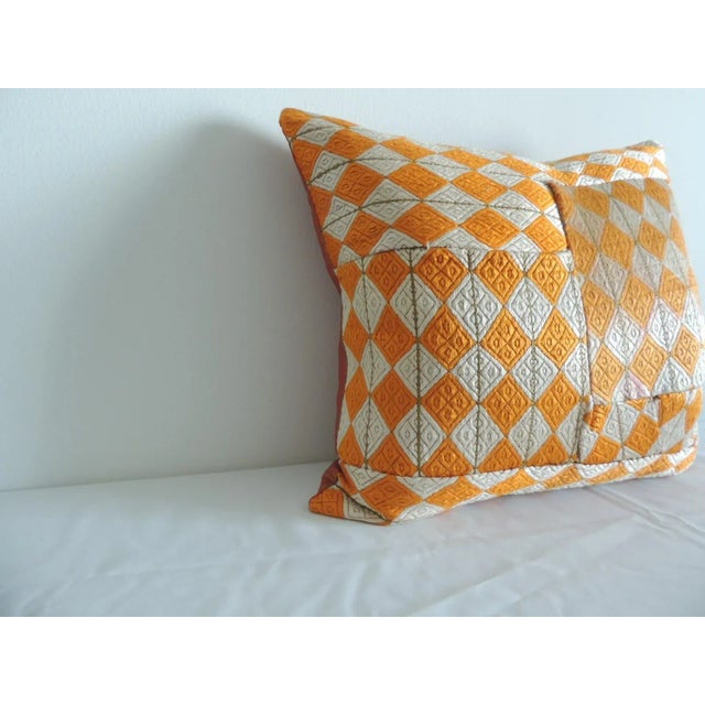 Patchwork pattern front. Woven vintage pillow with strie cotton red and orange textile backing. Feather/Down insert Size:...