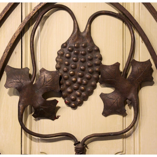 Circa 1920 bronze teller's window grate, likely Continental. Arts & Crafts period. Vintage motif with grapes & entwined...