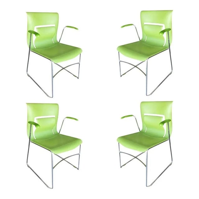 This piece is a simple, yet elegant modern "Rhythm" armchair featuring a chromed steel base with a molded "black twilight"...