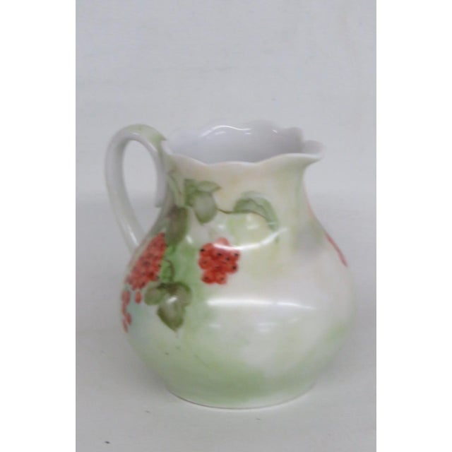 This adorable Creamer / Small Pitcher is made of ceramic. This creamer is stamped on the bottom " Vohenstrauss Johanna...
