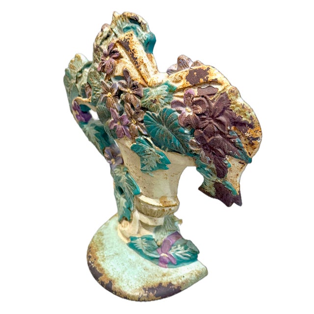 Vintage hand-painted iron floral urn doorstop. Marked "Midwest Importers" on the reverse side.