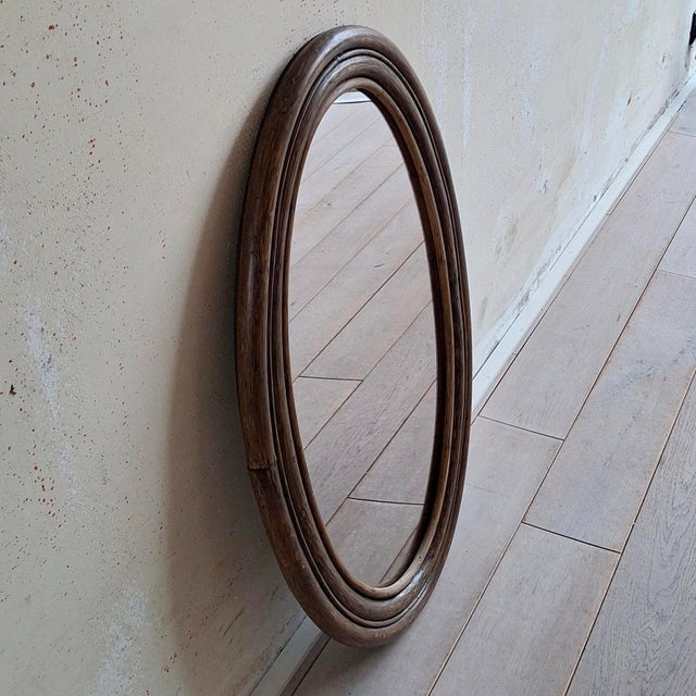Oval Rattan Manou Mirror, 1970s, in Good conditions. Designed 1970 to 1979