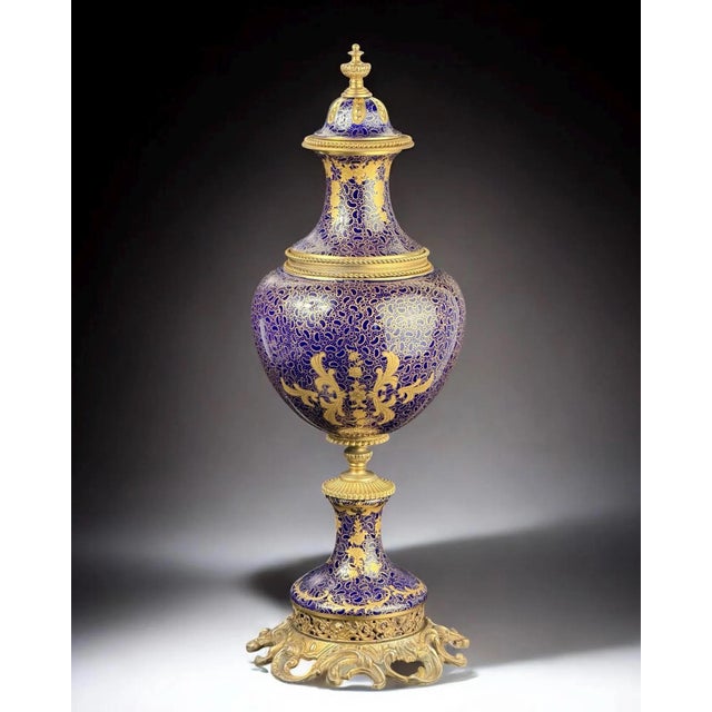 A striking and monumental covered vase, executed in the celebrated Sèvres taste, distinguished by its deep cobalt blue...